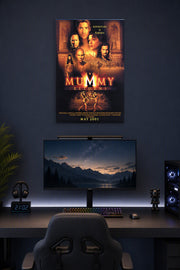 The Mummy Returns Movie Poster in a gaming desk setup above a monitor.