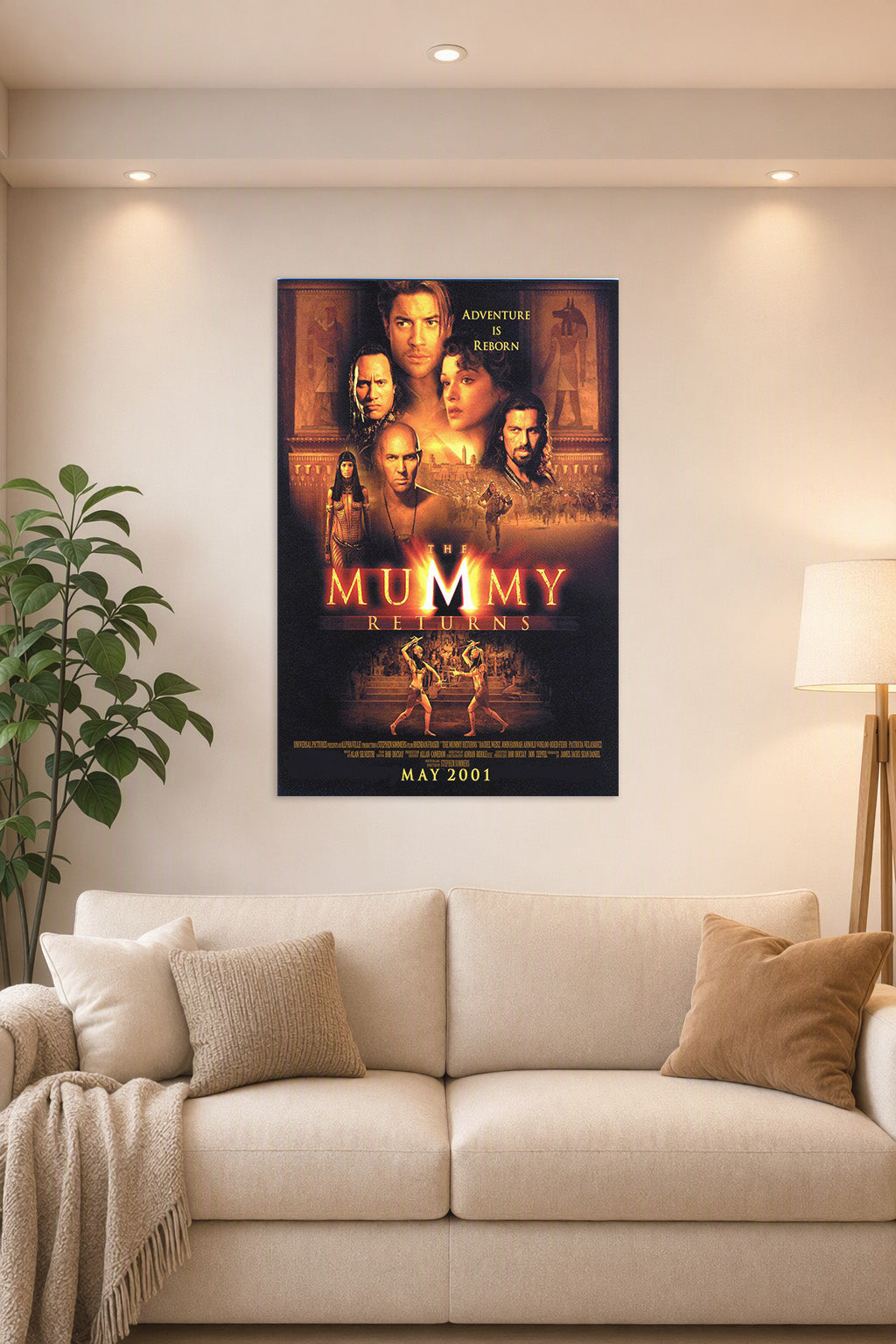 The Mummy Returns Movie Poster in a bright living room above a beige sofa.