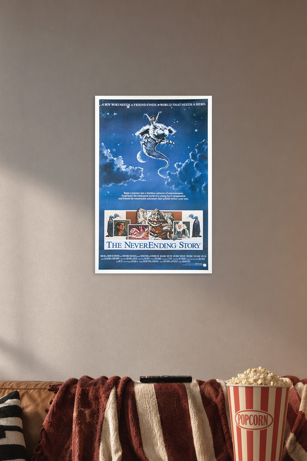 The NeverEnding Story in a cozy movie room above a brown sofa with popcorn.