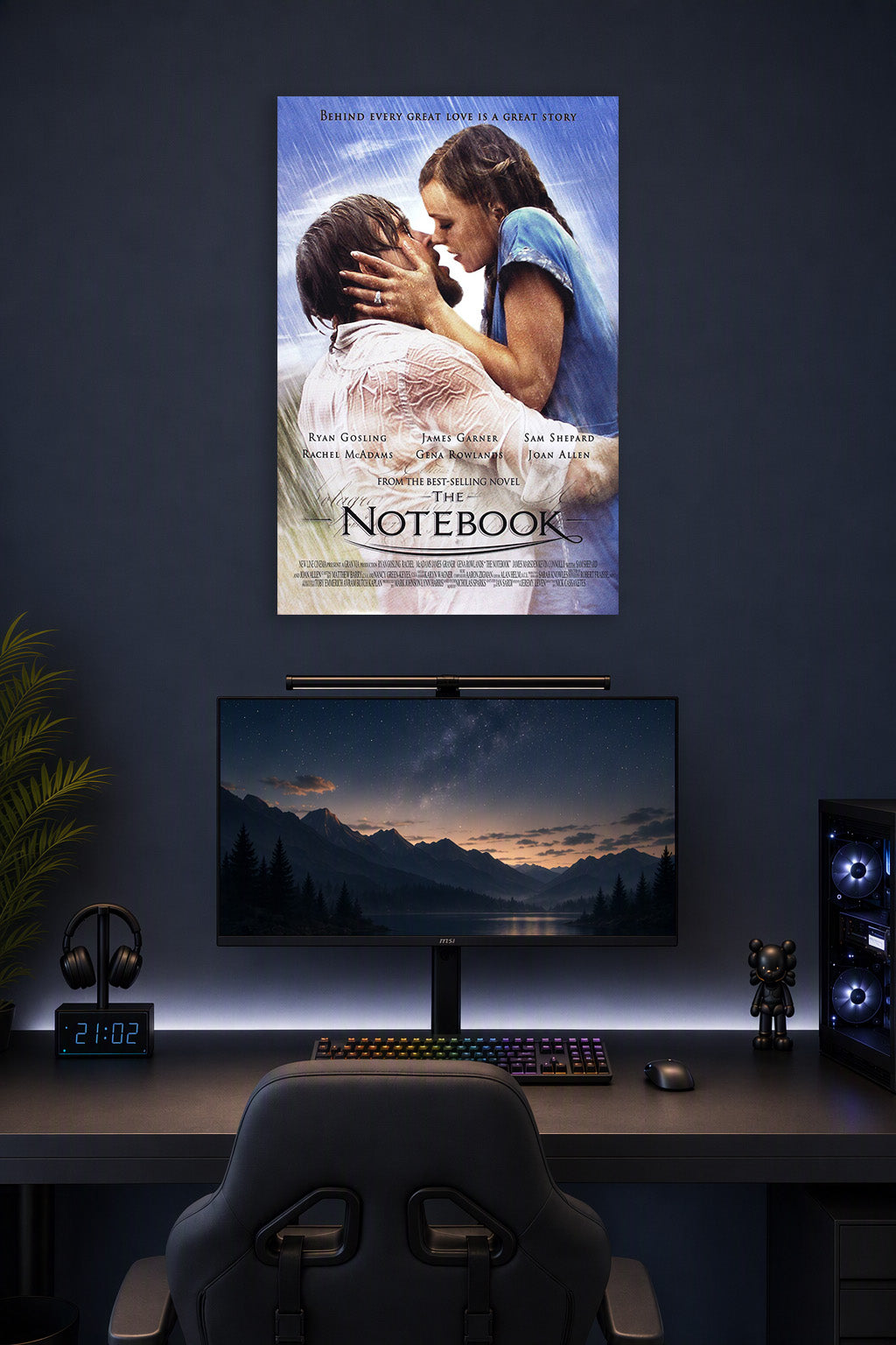 The Notebook Movie in a gaming desk setup above a monitor.