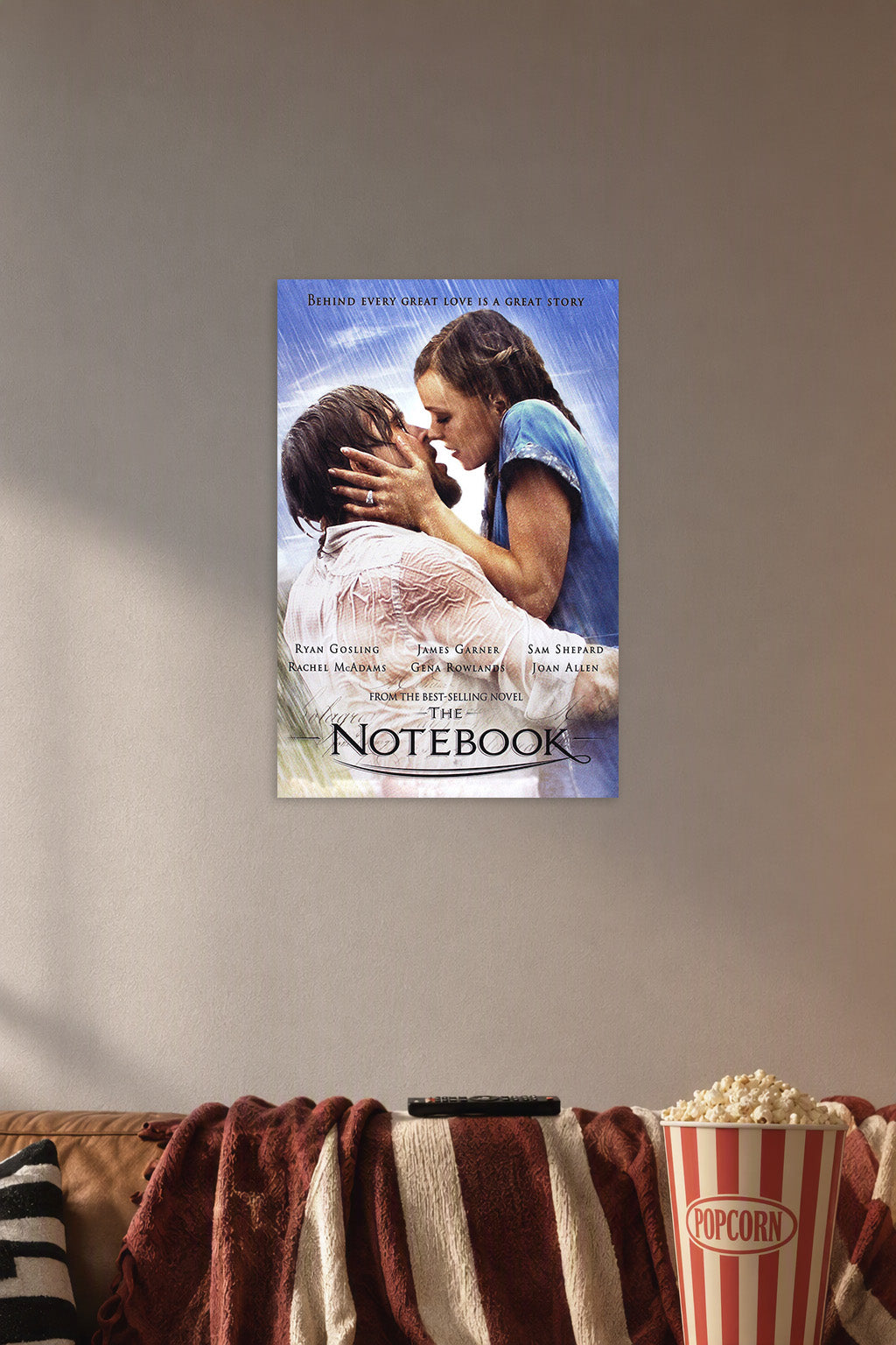 The Notebook Movies in a cozy movie room above a brown sofa with popcorn.