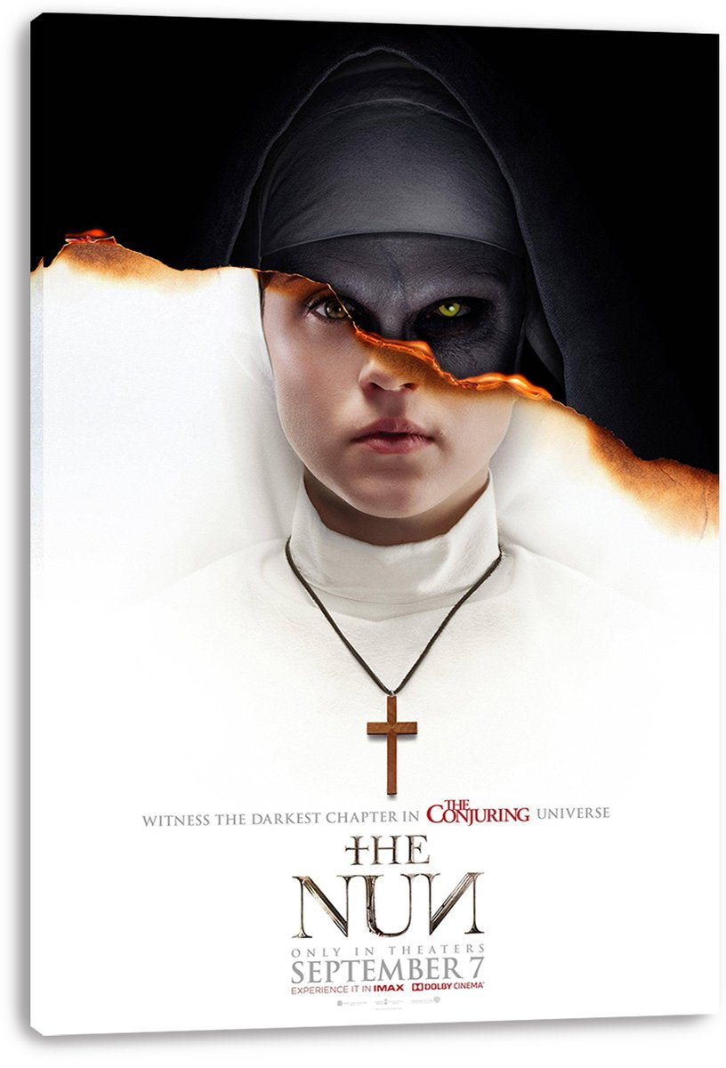 The Nun canvas wall art print presents a nun in white split by a glowing burnt-paper tear that reveals a dark green-eyed face.