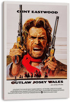 The Outlaw Josey Wales canvas wall art print displays Clint Eastwood gripping two pistols above silhouetted mounted riders.