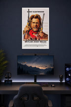 The Outlaw Josey Wales in a gaming desk setup above a monitor.