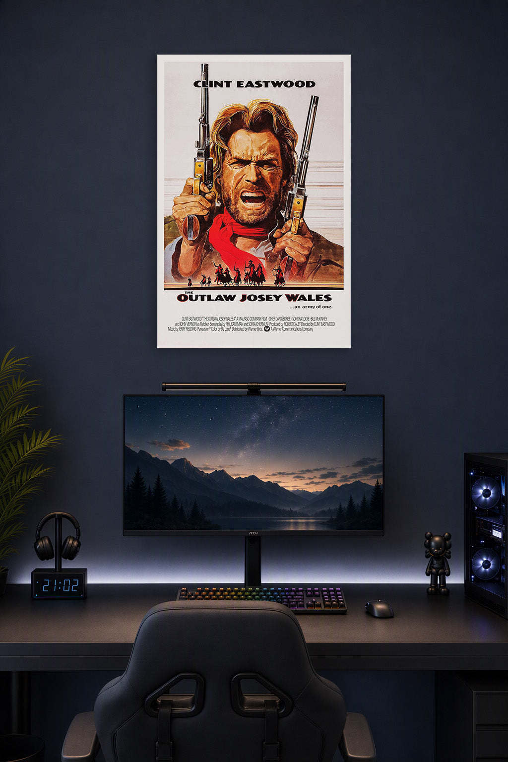 The Outlaw Josey Wales in a gaming desk setup above a monitor.