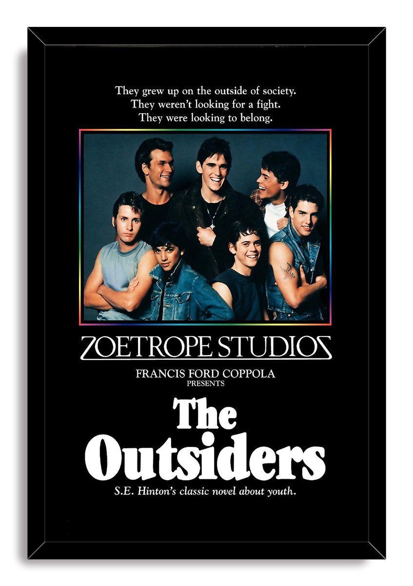 The Outsiders framed wall art print presents seven young men above bold white film typography in a slim black frame.