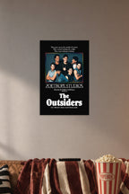 The Outsiders Movie Cast in a cozy movie room above a brown sofa with popcorn.