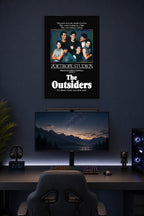 The Outsiders Movie Cast in a gaming desk setup above a monitor.