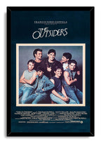 The Outsiders framed wall art print features the cast group portrait in denim, set against deep navy in a black frame.