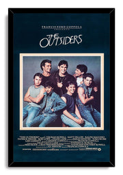 The Outsiders framed wall art print features the cast group portrait in denim, set against deep navy in a black frame.