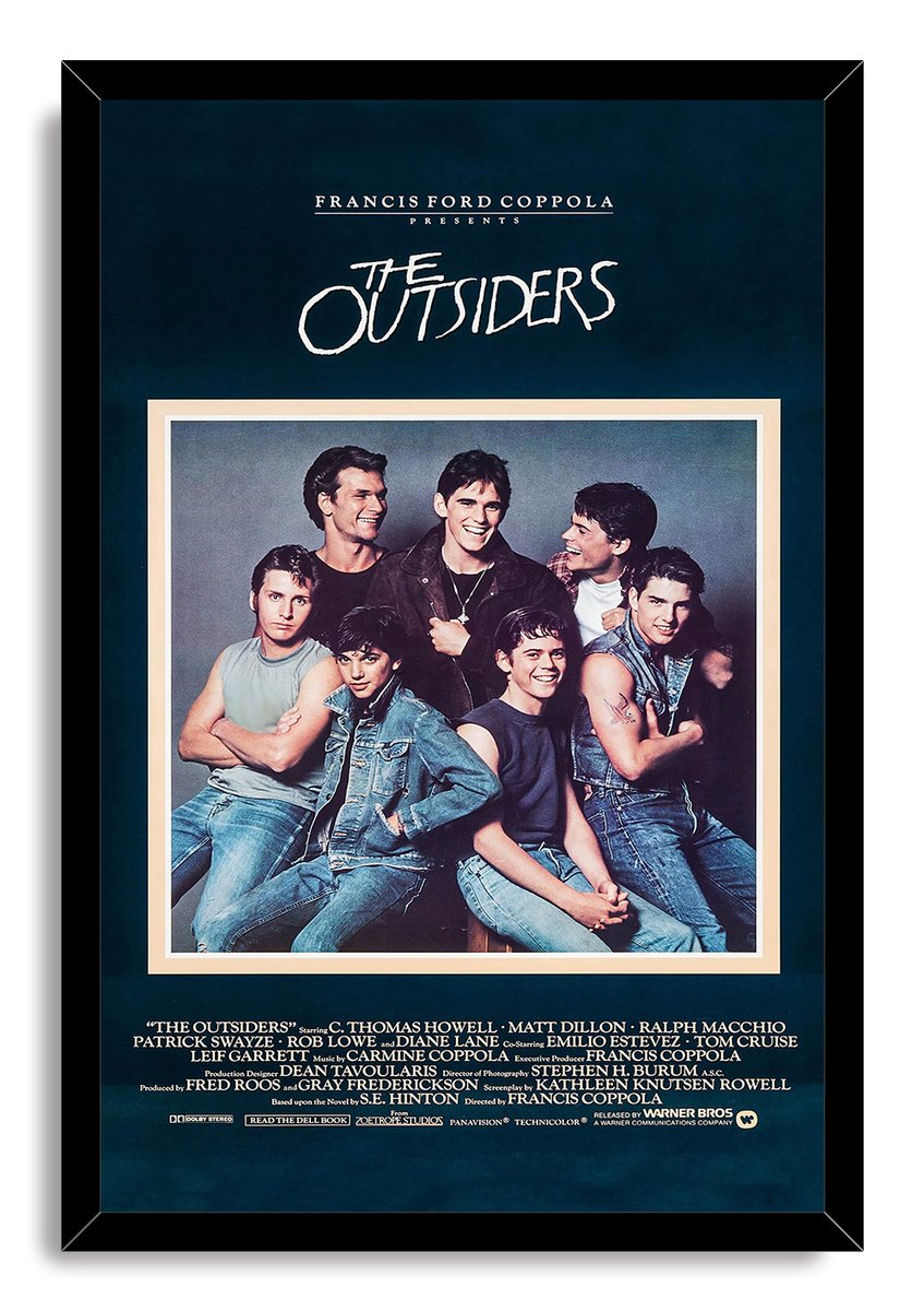The Outsiders framed wall art print features the cast group portrait in denim, set against deep navy in a black frame.
