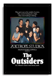 The Outsiders framed wall art print presents seven young men in a cast portrait with a multicolor border and bold white title.