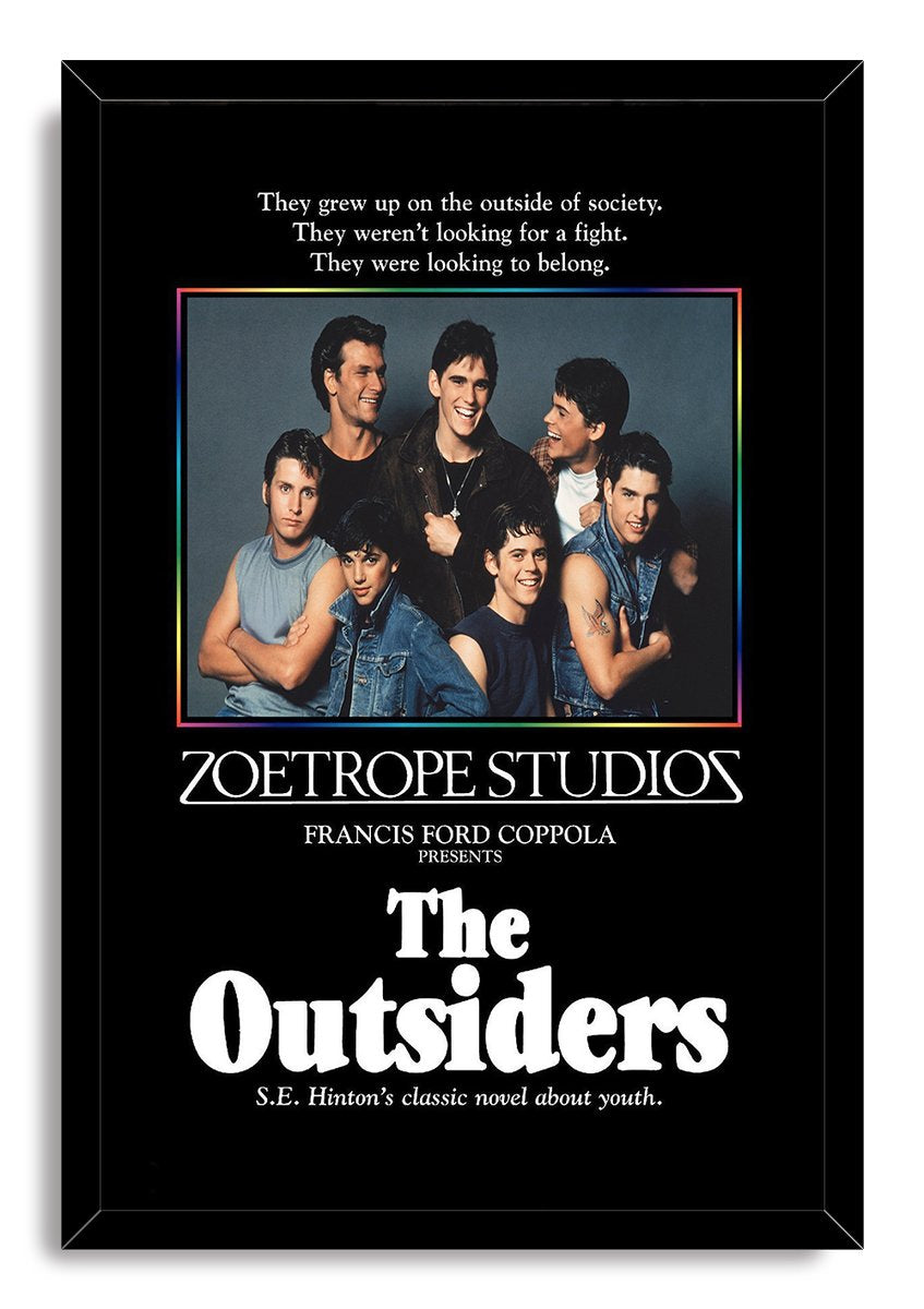 The Outsiders framed wall art print presents seven young men in a cast portrait with a multicolor border and bold white title.