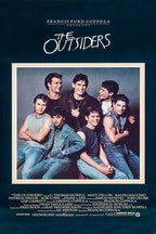 The Outsiders movie poster wall art features seven young men in denim beneath a white handwritten title on deep navy.