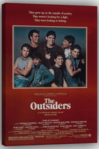 The Outsiders wall art print displays a group portrait of seven young men, bordered in cream above the film title and credits.