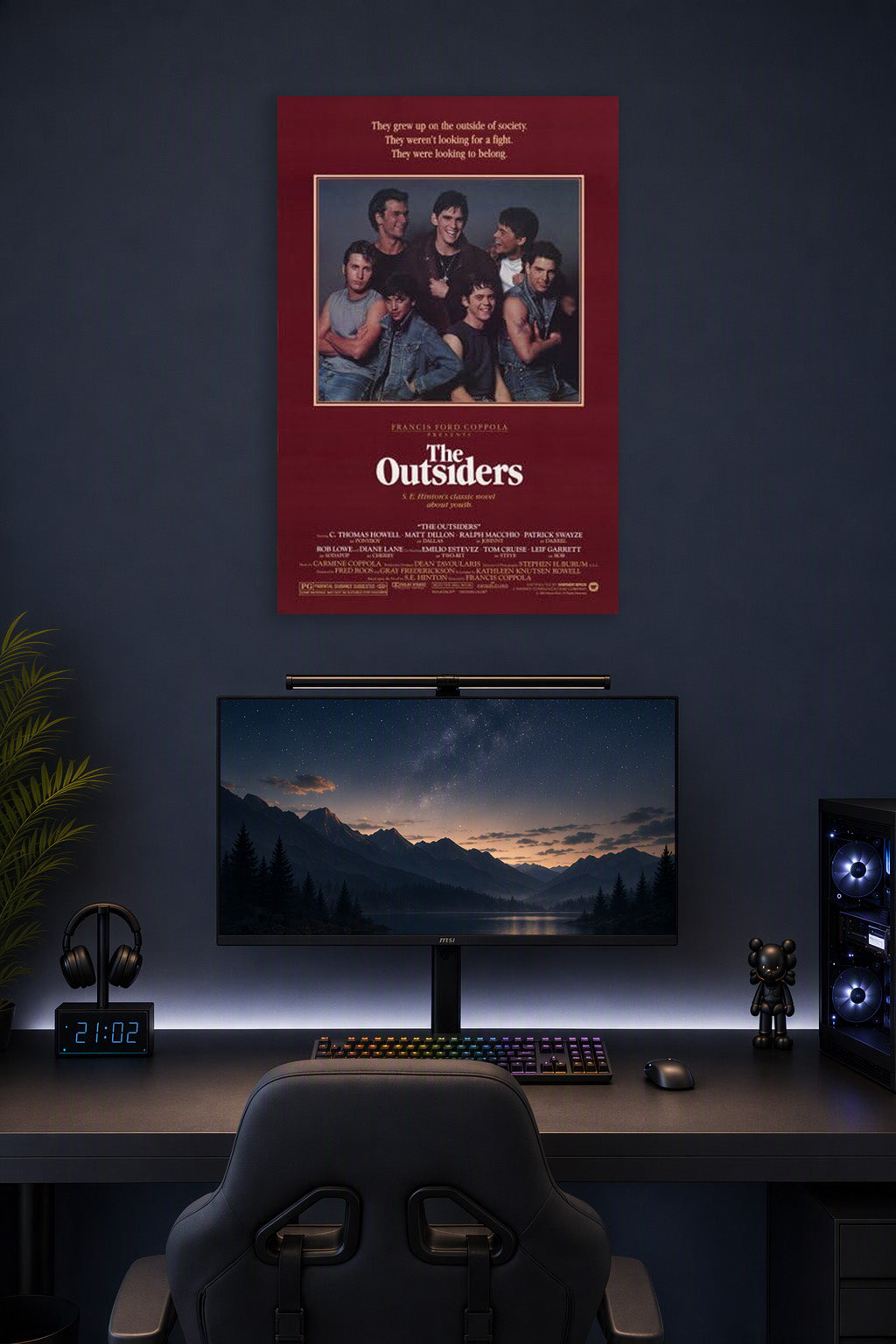 The Outsiders Movies in a gaming desk setup above a monitor.