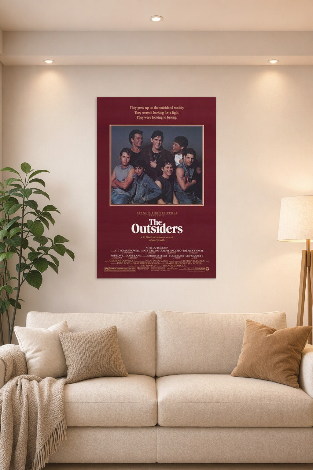 The Outsiders Movies in a bright living room above a beige sofa.