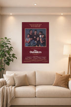 The Outsiders Movies in a bright living room above a beige sofa.