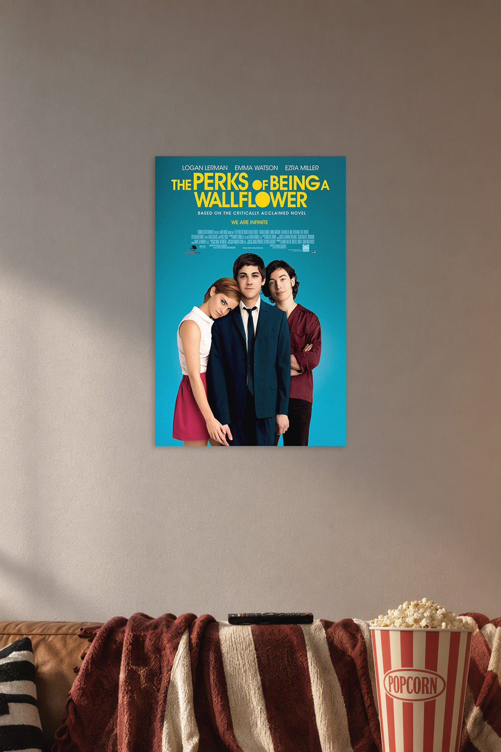 The Perks of Being a Wallflower Movie in a cozy movie room above a brown sofa with popcorn.