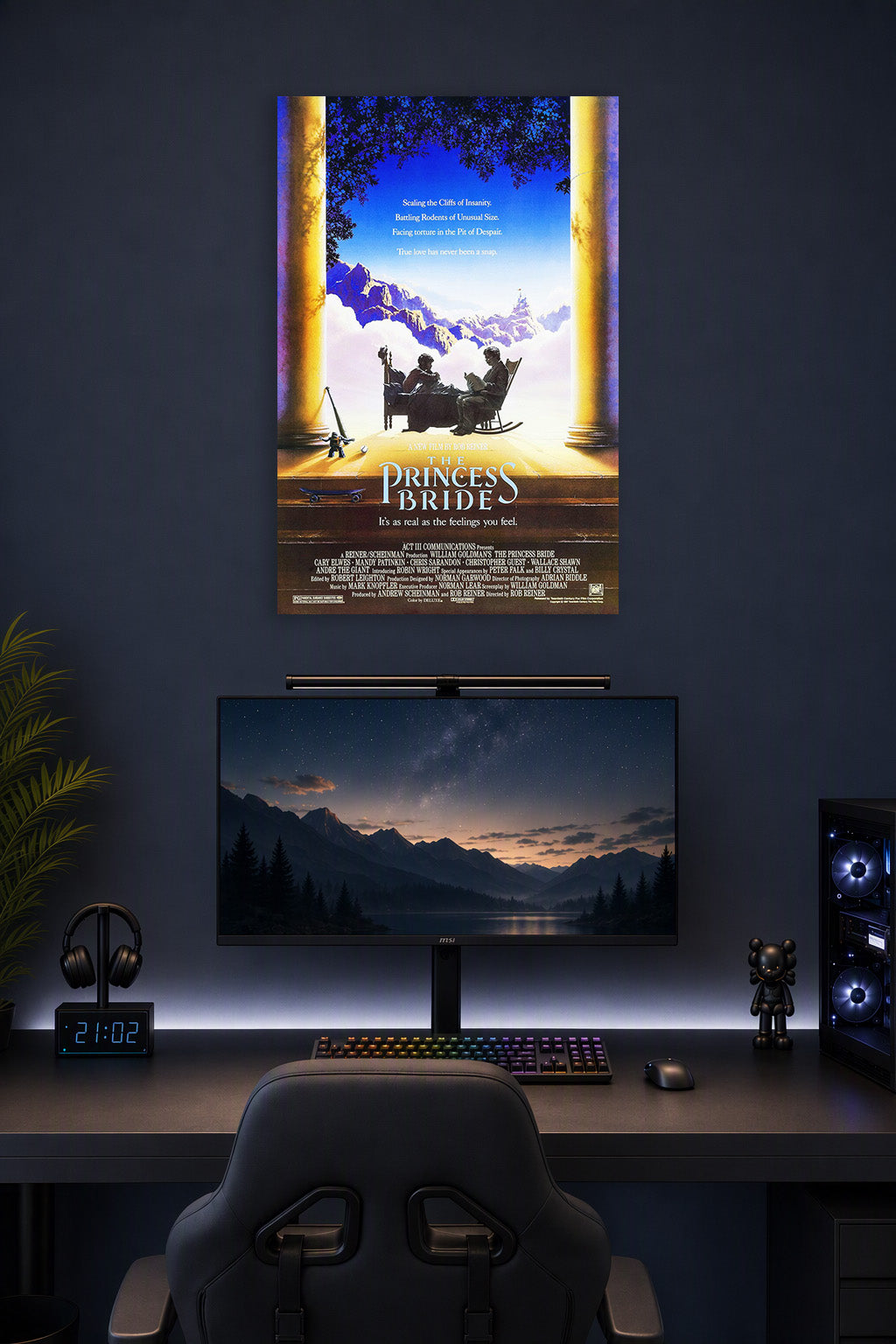 The Princess Bride Movie Poster in a gaming desk setup above a monitor.