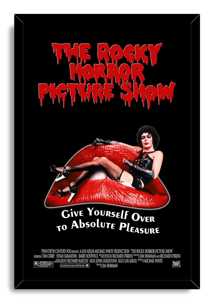 The Rocky Horror Picture Show framed wall art print features Dr. Frank-N-Furter reclining on red lips beneath bold dripping lettering.