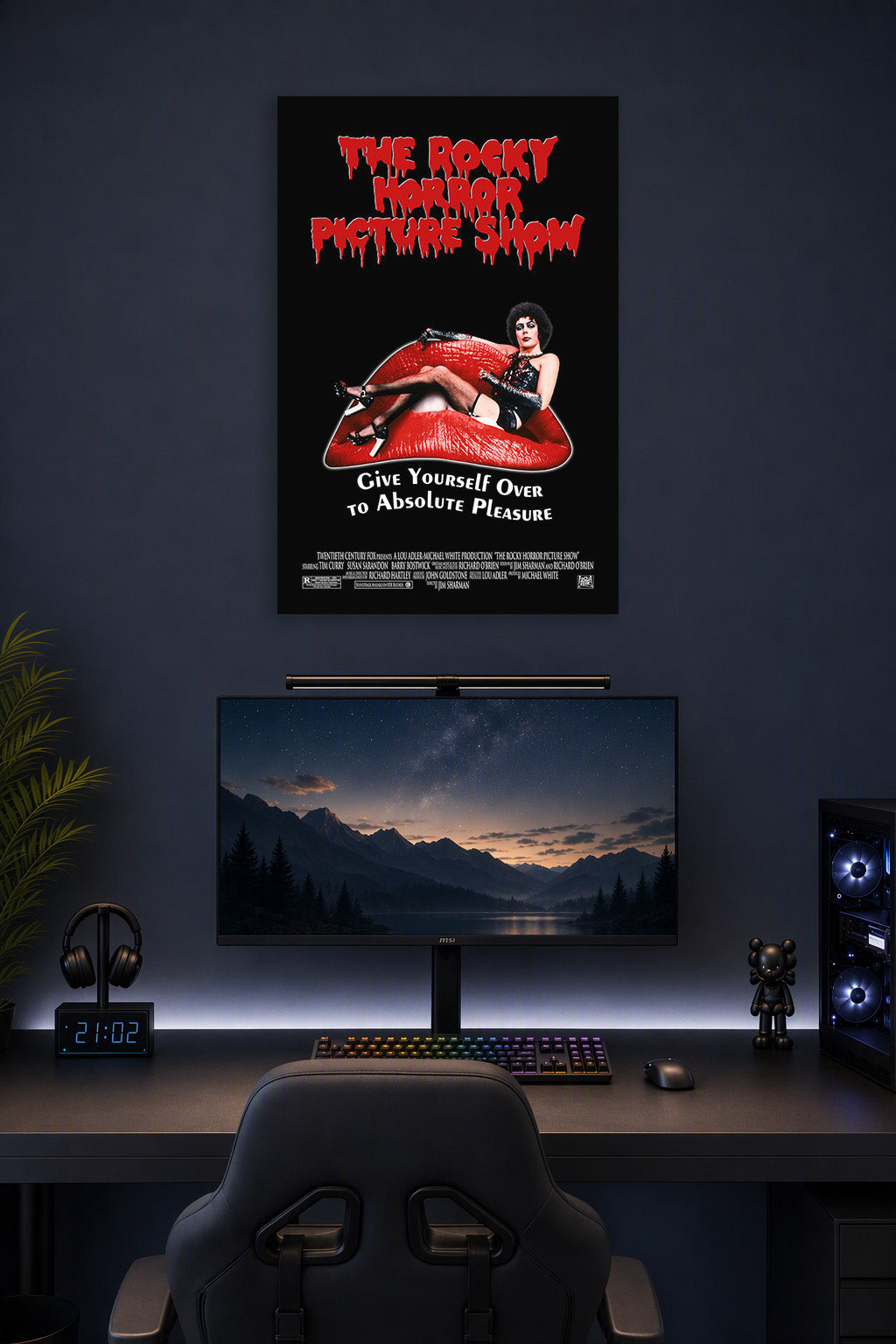 The Rocky Horror Picture Show in a gaming desk setup above a monitor.