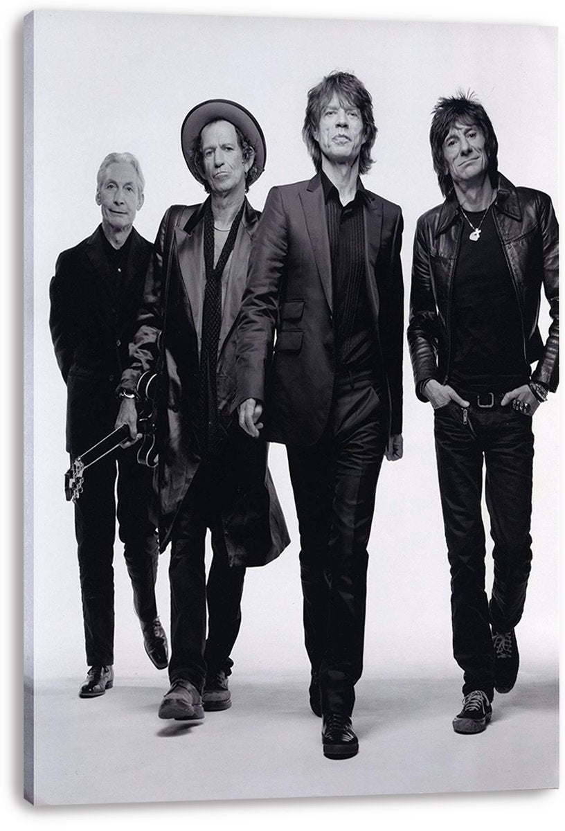 The Rolling Stones canvas wall art print displays four band members striding toward the camera in a monochrome studio portrait.
