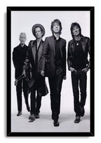 The Rolling Stones framed wall art print presents four band members walking forward, bordered by a sleek black frame.