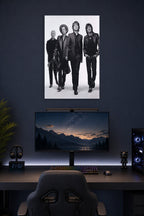 The Rolling Stones in a gaming desk setup above a monitor.