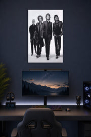 The Rolling Stones in a gaming desk setup above a monitor.