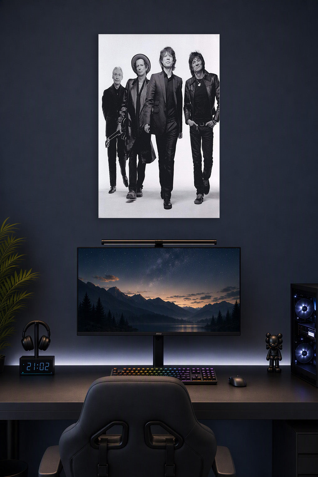 The Rolling Stones in a gaming desk setup above a monitor.