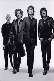 The Rolling Stones poster features four band members walking forward in black suits and leather jackets against a pale studio backdrop.