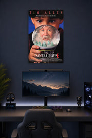 The Santa Clause Movie Poster in a gaming desk setup above a monitor.