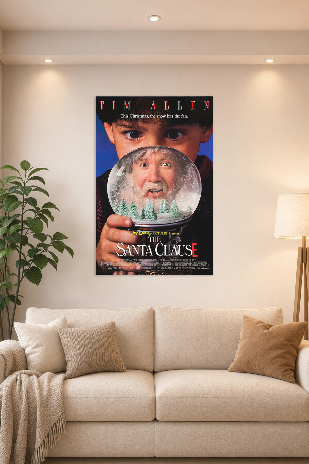 The Santa Clause Movie Poster in a bright living room above a beige sofa.