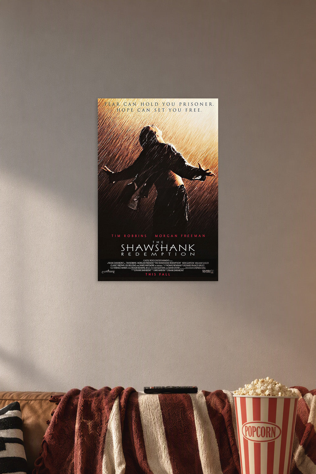 The Shawshank Redemption Andy Dufresne in a cozy movie room above a brown sofa with popcorn.