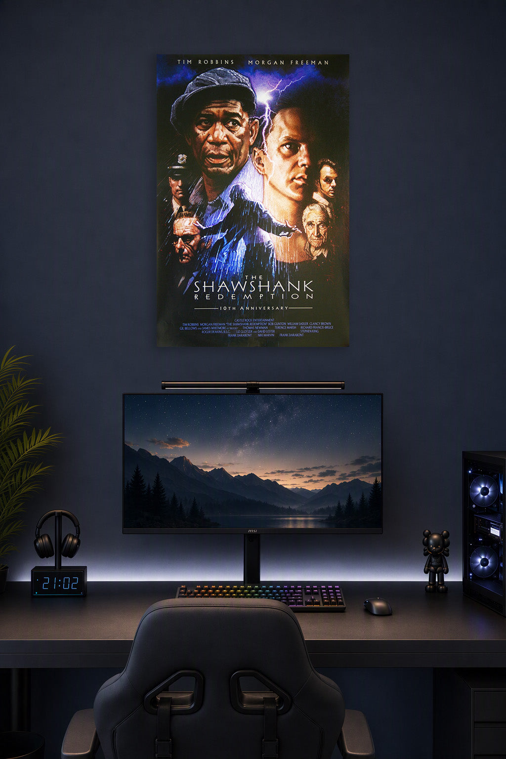The Shawshank Redemption Movie Poster in a gaming desk setup above a monitor.