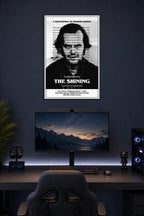 The Shining Jack Nicholson in a gaming desk setup above a monitor.
