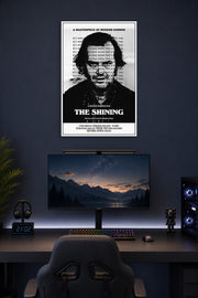 The Shining Jack Nicholson in a gaming desk setup above a monitor.