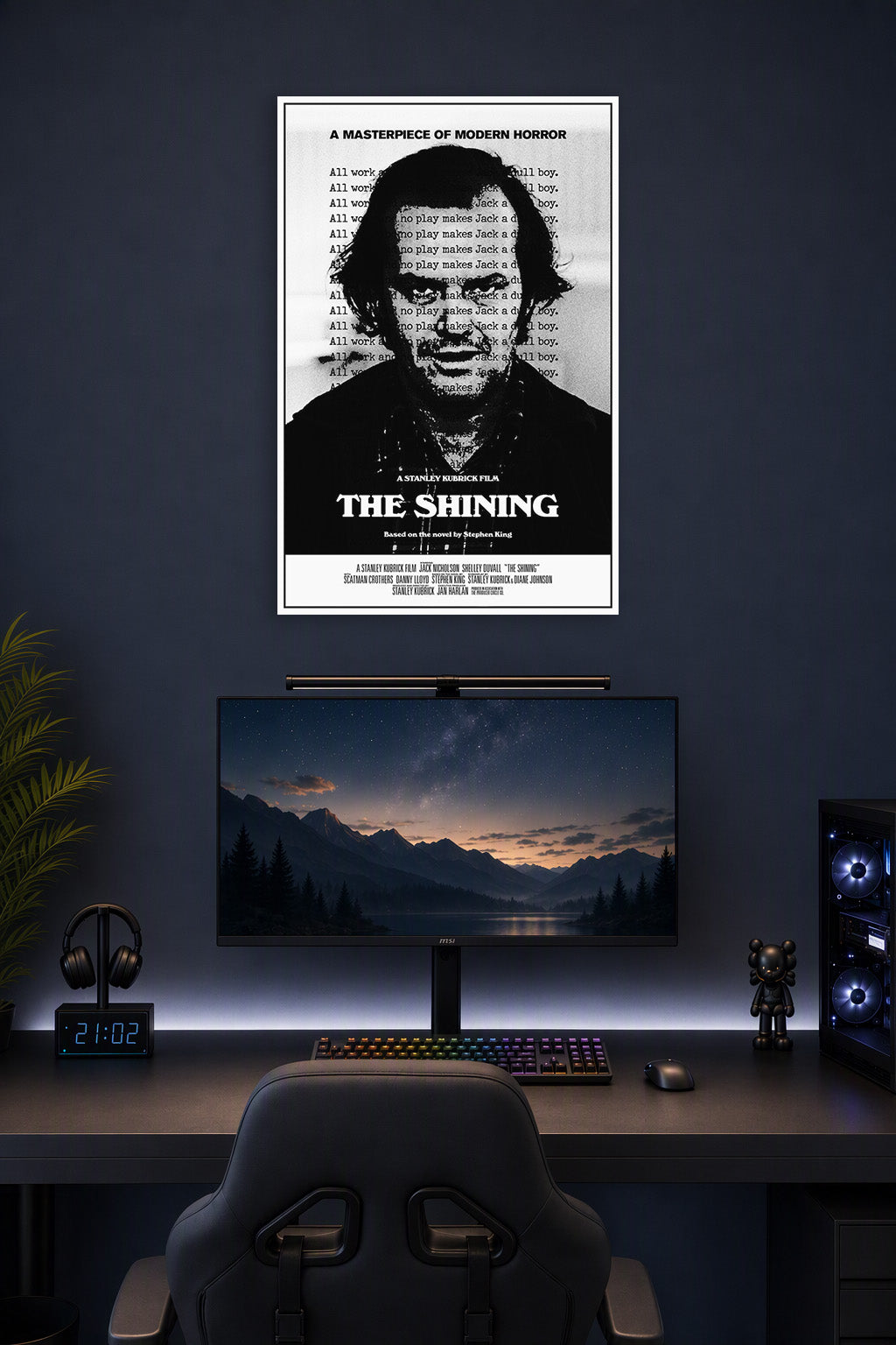 The Shining Jack Nicholson in a gaming desk setup above a monitor.