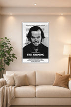 The Shining Jack Nicholson in a bright living room above a beige sofa.