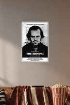 The Shining Jack Nicholson in a cozy movie room above a brown sofa with popcorn.
