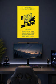 The Shining Movie Poster in a gaming desk setup above a monitor.