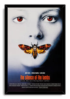 The Silence of the Lambs framed wall art print features a red-eyed face, orange skull-marked moth, and black border frame.