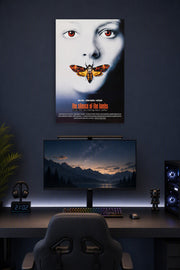 The Silence of the Lambs Movie Poster in a gaming desk setup above a monitor.