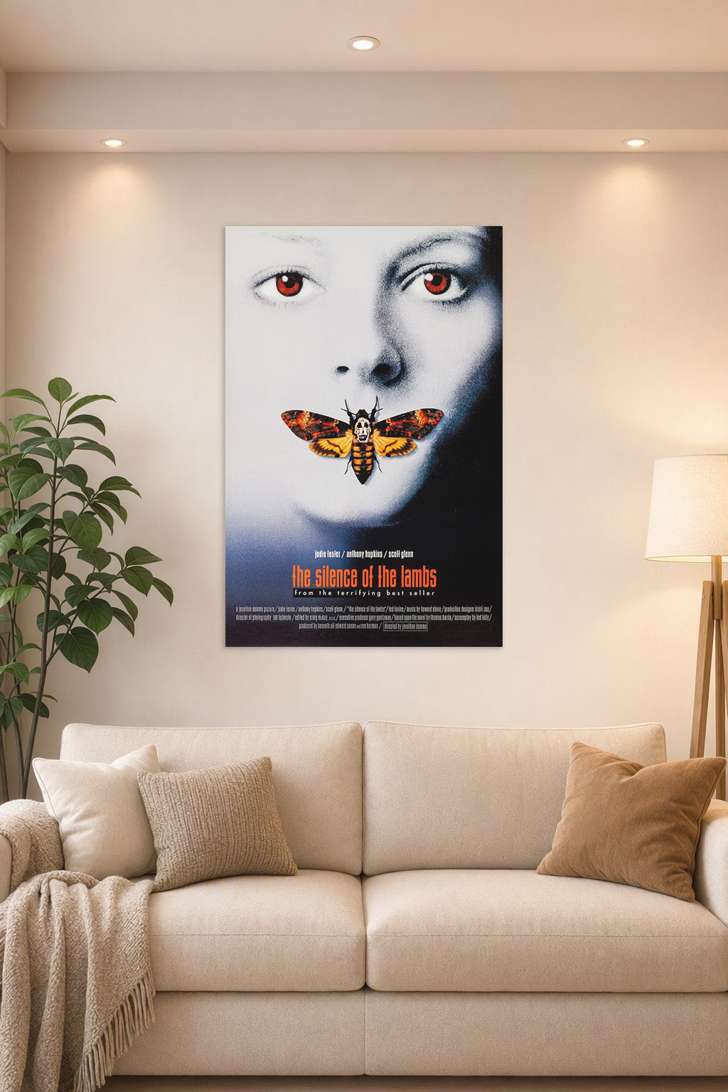 The Silence of the Lambs Movie Poster in a bright living room above a beige sofa.