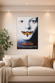 The Silence of the Lambs Movie Poster in a bright living room above a beige sofa.
