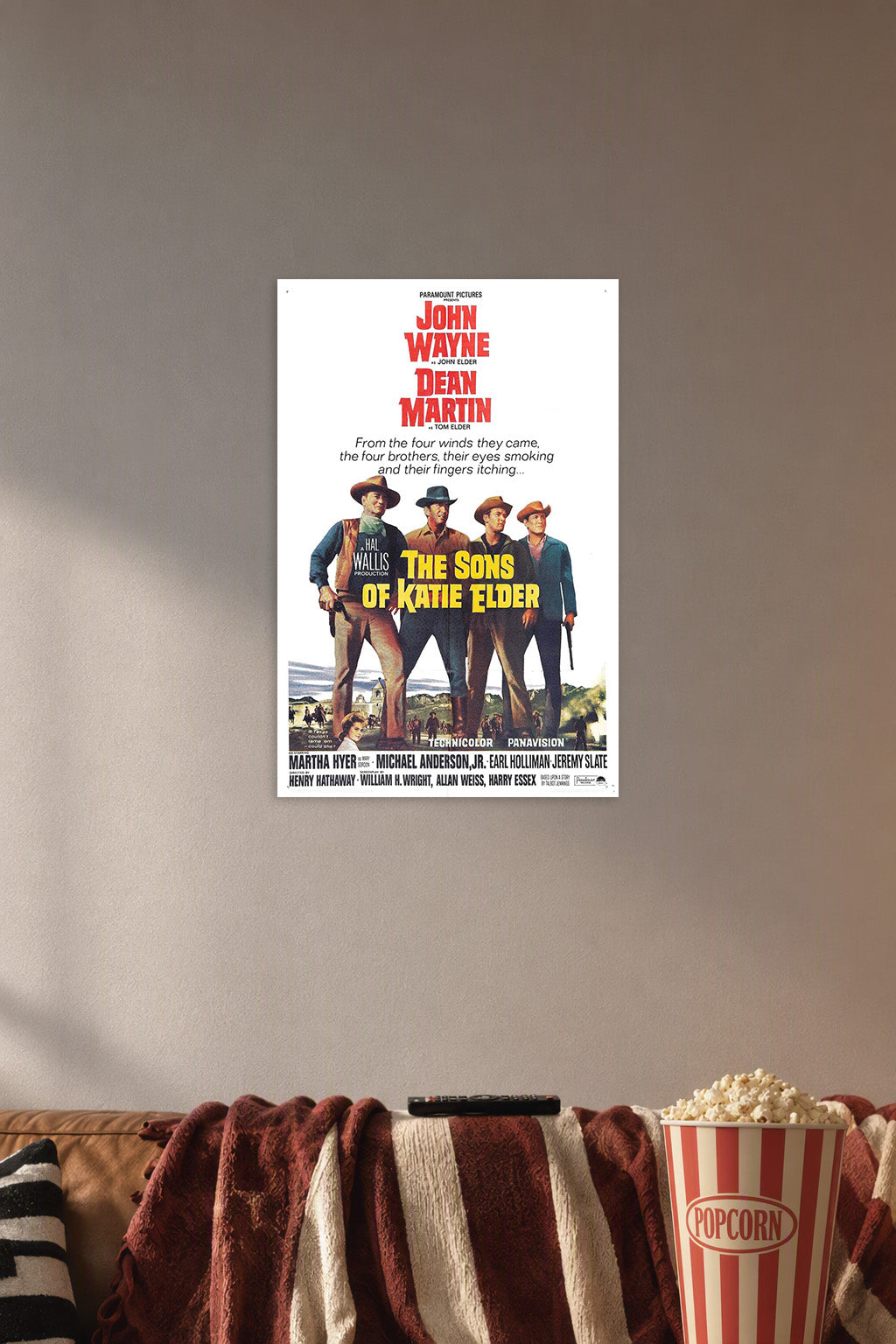 The Sons of Katie Elder John Wayne Dean Martin in a cozy movie room above a brown sofa with popcorn.