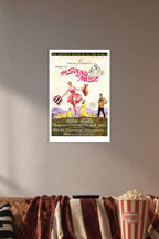 The Sound of Music Movie Poster in a cozy movie room above a brown sofa with popcorn.