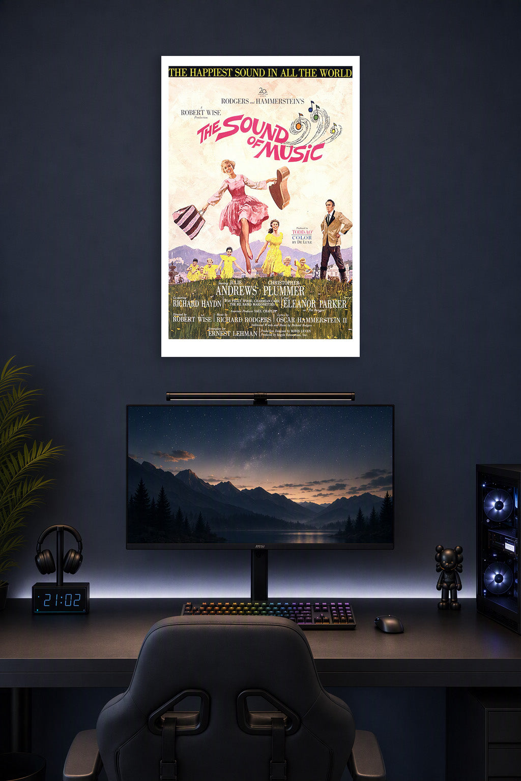 The Sound of Music Movie Poster in a gaming desk setup above a monitor.
