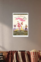 The Sound of Music Movie Poster in a cozy movie room above a brown sofa with popcorn.